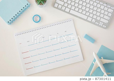 flat lay planner calendar with blue accessories 87301411