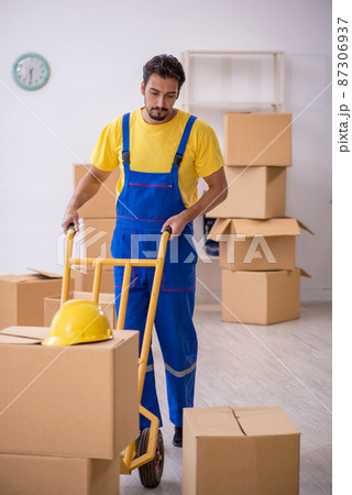 Young male contractor doing home relocation Young male contractor doing home relocation 87306937