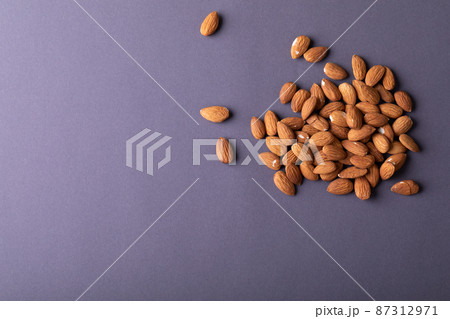 Directly above shot of nutritious almonds on gray background with copy space 87312971