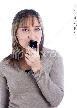 Talking woman by mobile over white Talking woman by mobile over white 87314323