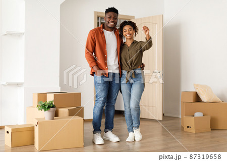 Joyful Black Couple Showing Key Standing In New House 87319658