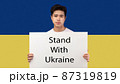 Asian Guy Holding Placard Standing With Ukraine 87319819
