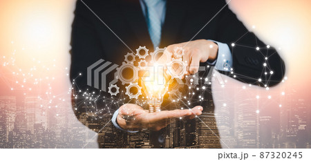 Concept creativity with light bulbs and energy power,Businessman hand holding light bulb and gear web engineering to success on metal texture background, technology and innovation concept, Concept creativity with light bulbs and energy power,Businessman hand holding light bulb and gear web engineering to success on metal texture background, technology and innovation concept, 87320245