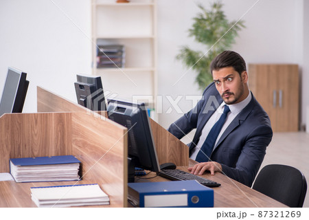 Young male employee in industrial espionage concept Young male employee in industrial espionage concept 87321269