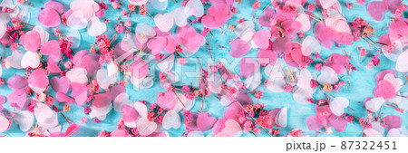 Valentine day or wedding panorama with pink hearts and flowers confetti Valentine day or wedding panorama with pink hearts and flowers confetti 87322451