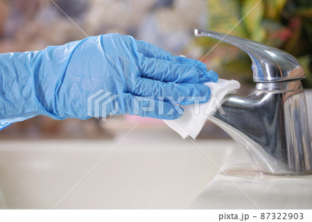hand in gloves cleaning tap and washbasin, 87322903