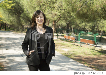 Mature woman in positive attitude Mature woman in positive attitude 87323964