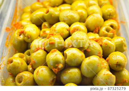 Pitted and pitted green olives with pepper and carrot Pitted and pitted green olives with pepper and carrot 87325279