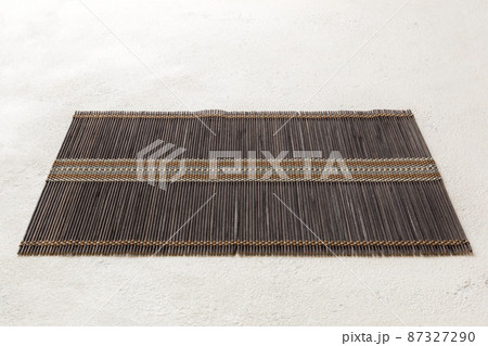 Perspective view of brown tablecloth for food on cement background. Empty space for your design 87327290