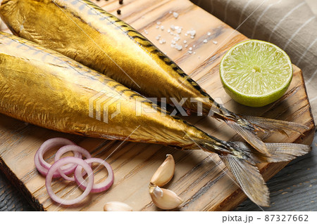 Tasty smoked fish on wooden table, closeup Tasty smoked fish on wooden table, closeup 87327662