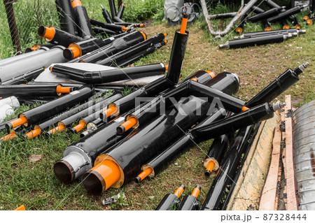 A bunch of polyethylene water pipes of the heating material pvc pipeline at the industrial site A bunch of polyethylene water pipes of the heating material pvc pipeline at the industrial site 87328444