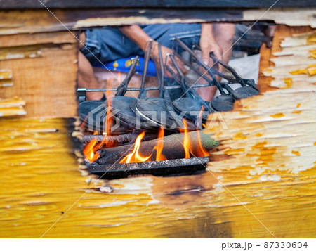 Close up shot of man grilling food Close up shot of man grilling food 87330604