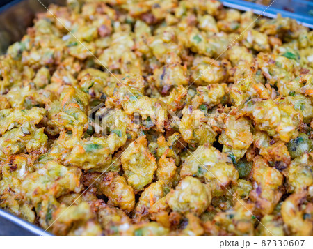 Close up shot of deep fried Oyster fritter Close up shot of deep fried Oyster fritter 87330607