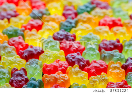 closeup full-frame background of colorful jelly bears laid closely on flat surface closeup full-frame background of colorful jelly bears laid closely on flat surface 87331224