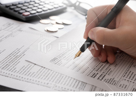 Tax return concept wits US 1040 tax form 87331670