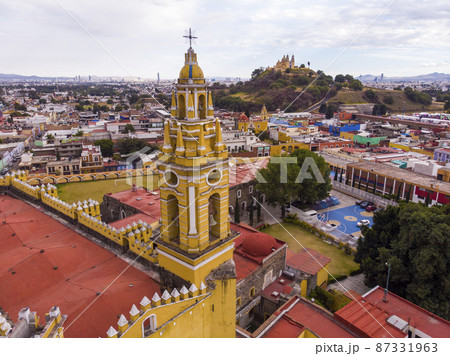 Aerial Drone Shot of San Gabriel Archangel Cathedral at cloudy day in Cholula, Puebla, Mexico 87331963