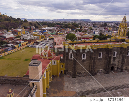 Aerial Drone Shot of San Gabriel Archangel Cathedral at cloudy day in Cholula, Puebla, Mexico 87331964