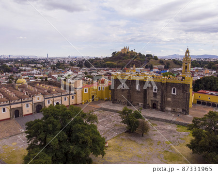 Aerial Drone Shot of San Gabriel Archangel Cathedral at cloudy day in Cholula, Puebla, Mexico 87331965