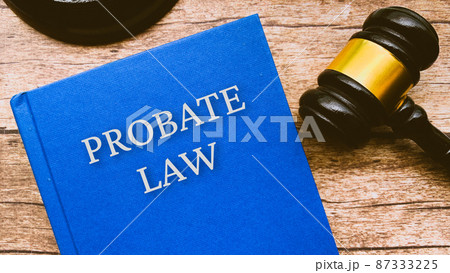 Probate law and gavel on a brown wooden table. Law and legal concept Probate law and gavel on a brown wooden table. Law and legal concept 87333225