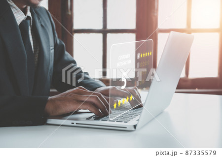 Businessman finger pointing smiley face emoticon on virtual touch screen.good feedback rating and positive customer review, experience, satisfaction survey, world mental health day concept.. 87335579