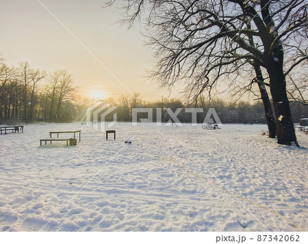 Winter sunset in snow covered park. Season and cold weather concept 87342062