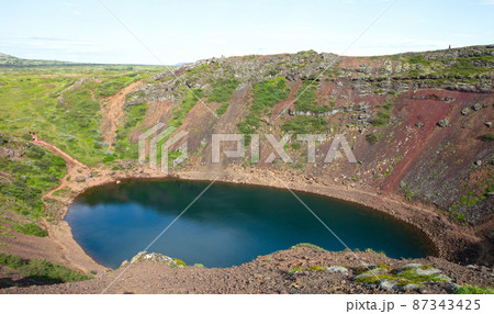 Kerid is a beautiful crater lake of a turquoise color located on the South-West of Iceland 87343425