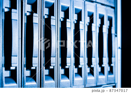 Row of hard drives serving as data storage inside server room 87347017
