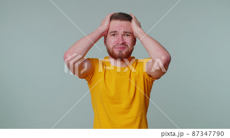 Young man waiting for good luck, loses becoming surprised sudden lottery results, bad fortune loss Young man waiting for good luck, loses becoming surprised sudden lottery results, bad fortune loss 87347790