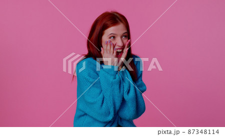 Girl wish for good luck and becoming surprised about sudden dream come true, waiting lottery winning Girl wish for good luck and becoming surprised about sudden dream come true, waiting lottery winning 87348114