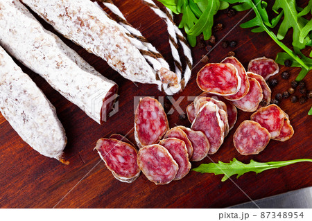 Traditional spanish thin salami sausage Fuet, sliced Traditional spanish thin salami sausage Fuet, sliced 87348954