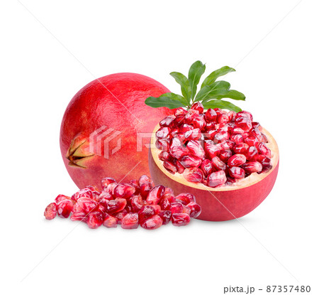 Fresh ripe pomegranate with leaves isolated on white background 87357480