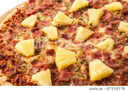 Hawaiian pizza with pineapple,ham and cheese isolated on white background 87359578