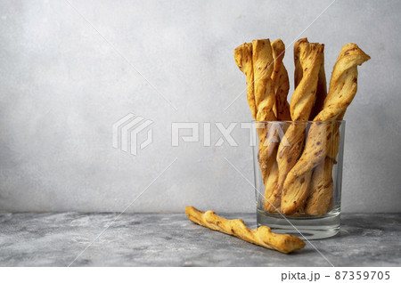 Cheese breadsticks with cheese in glass, snack food. Copy space. Cheese breadsticks with cheese in glass, snack food. Copy space. 87359705