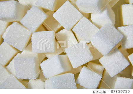 Flat lay macro white sugar cubes close up texture background Flat lay macro white sugar cubes close up texture background 87359759