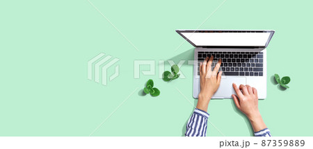 Laptop computer with shamrock leaves 87359889