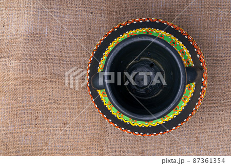 Top view of a black Egyptian handcrafted artistic pottery jar Top view of a black Egyptian handcrafted artistic pottery jar 87361354