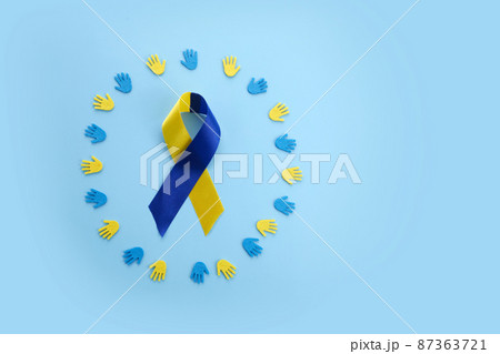World Down syndrome day background. Down syndrome awareness concept. Ribbon on blue background 87363721
