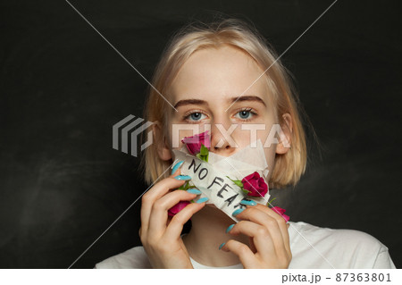 Strength teenager girl with closed mouth riping the gag off her mouth. Awkward age, growing up Strength teenager girl with closed mouth riping the gag off her mouth. Awkward age, growing up 87363801