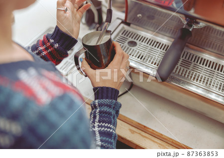 The process of whipping milk in coffee machine 87363853