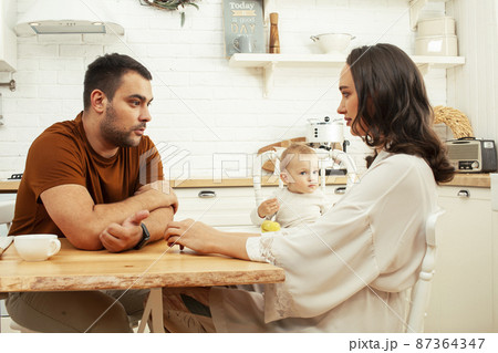 young family with little cute son on kitchen in morning happy smiling, lifestyle people concept 87364347