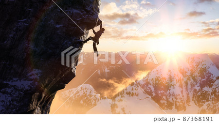 Adult adventurous man Rock Climbing a steep rocky cliff. 87368191