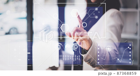 By using a visual indicator on the screen, an IT consultant may manage large amounts of data and analyze financial documents. Technology, Hologram, VR, Metaverse concept. 87368859