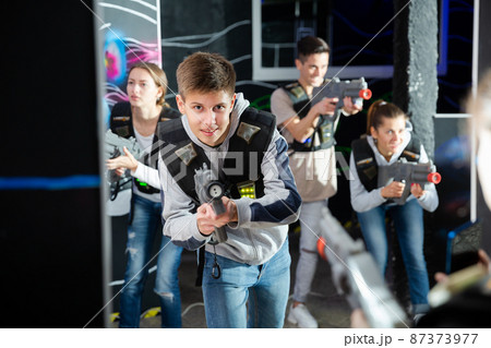 Teenager boy having fun on lasertag arena 87373977