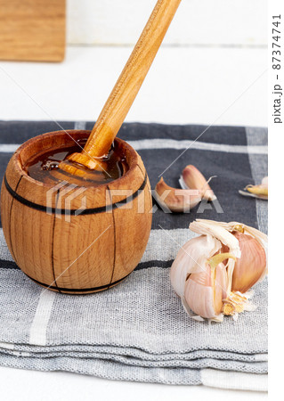 Fermented garlic honey, honey for strong immunity. Vertical photo Fermented garlic honey, honey for strong immunity. Vertical photo 87374741