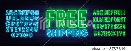 Free shipping neon sign on brick wall background 87378444