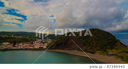 Sunset view to Horta, Porto Pim Bay and beach from mount Guia, Faial island, Azores, Portugal Sunset view to Horta, Porto Pim Bay and beach from mount Guia, Faial island, Azores, Portugal 87380440