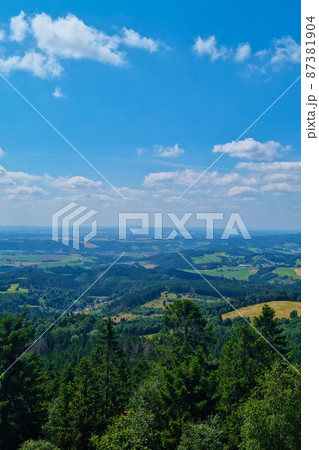 A picturesque view of the mountains on a sunny summer day. View from a height. 87381904