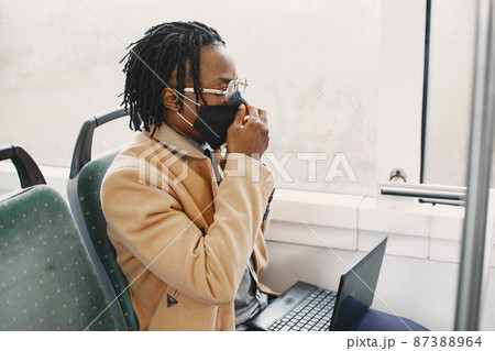 Young African businessman sitting in a bus 87388964