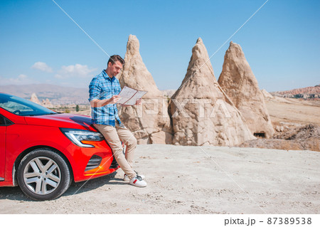 Happy man on summer vacation in famous place. Cave formations. 87389538