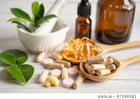 Alternative medicine herbal organic capsule with vitamin E omega 3 fish oil, mineral, drug with herbs leaf natural supplements for healthy good life. 87390381